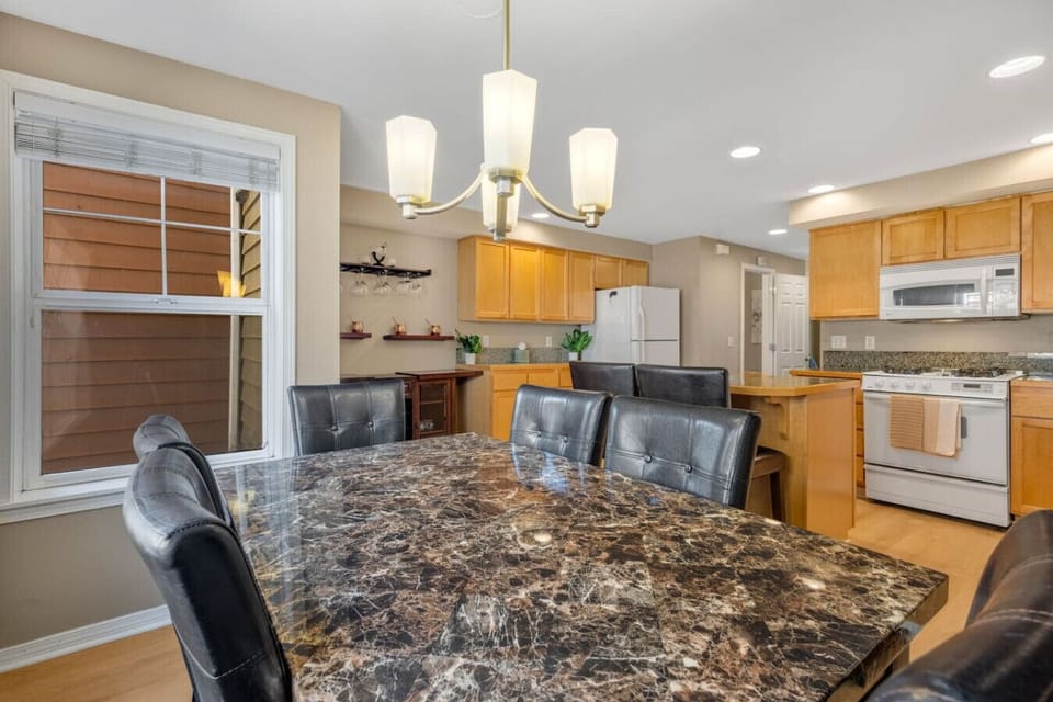 Open dining & kitchen space w/ granite table, bar seating & room to gather comfortably