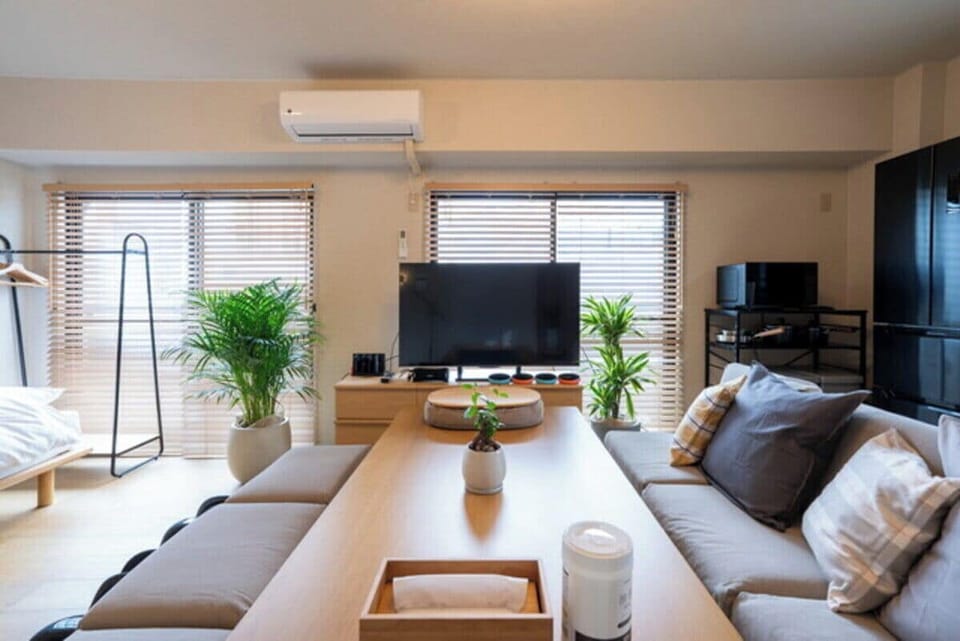 Comfort Apartment | Living area | 50-inch flat-screen TV with digital channels, video-game console