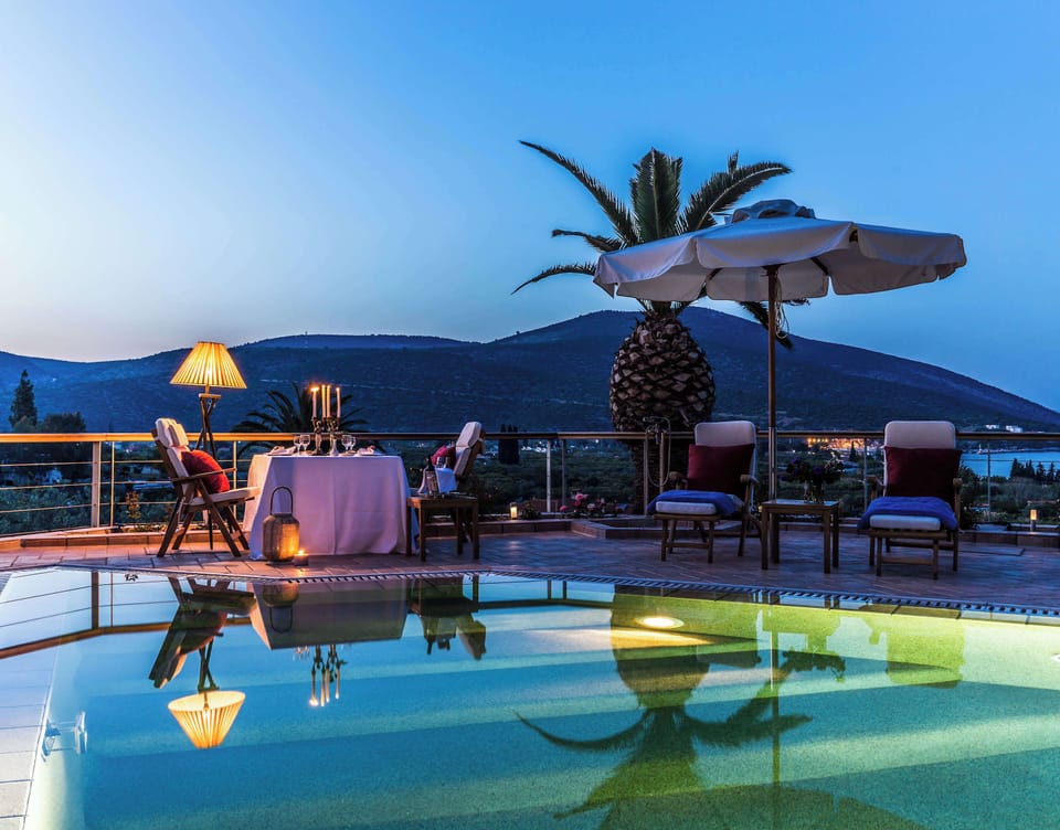 Evening Pool Area with Palm Trees and Relaxing Atmosphere