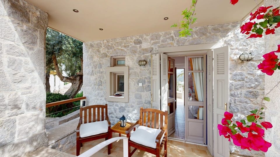 Bright Exterior patio with Pool Views and Floral Accents