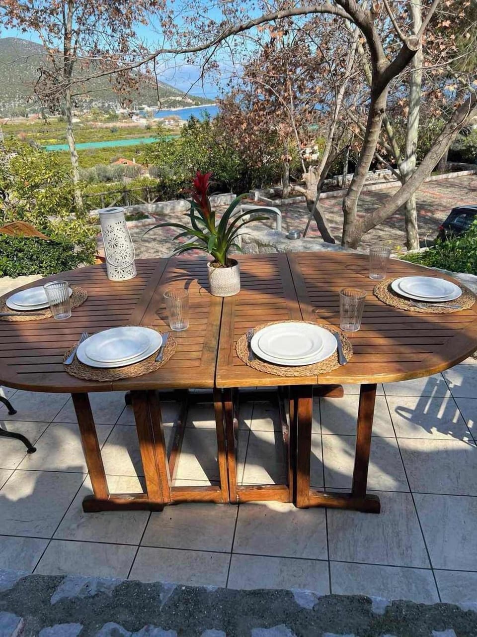 Outdoor Dining Setup in Garden with Wooden Table