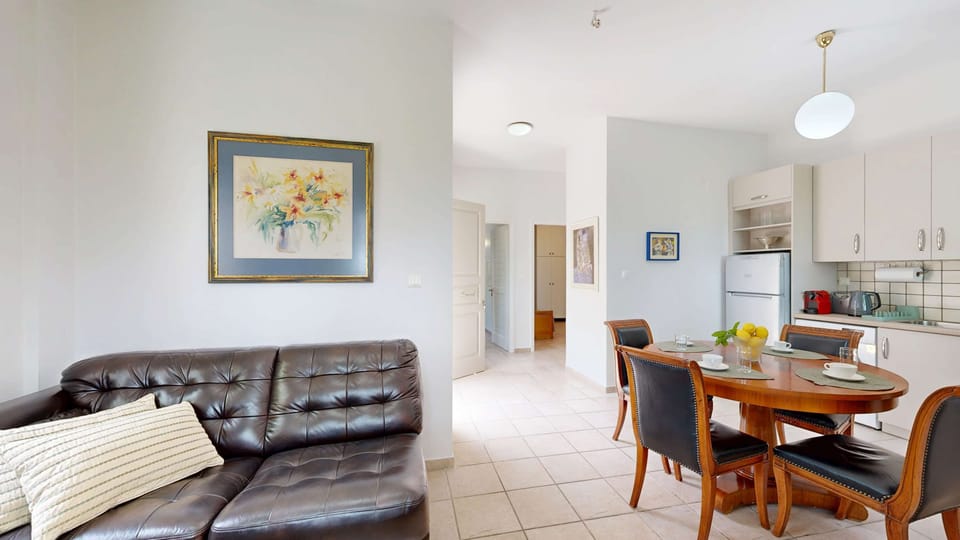 Open-Plan Living Area with Sofa and Dining Table