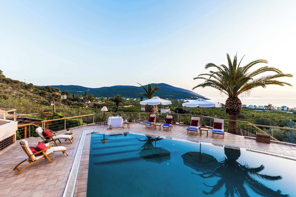 Resort-Style Pool Area Surrounded by Palm Trees