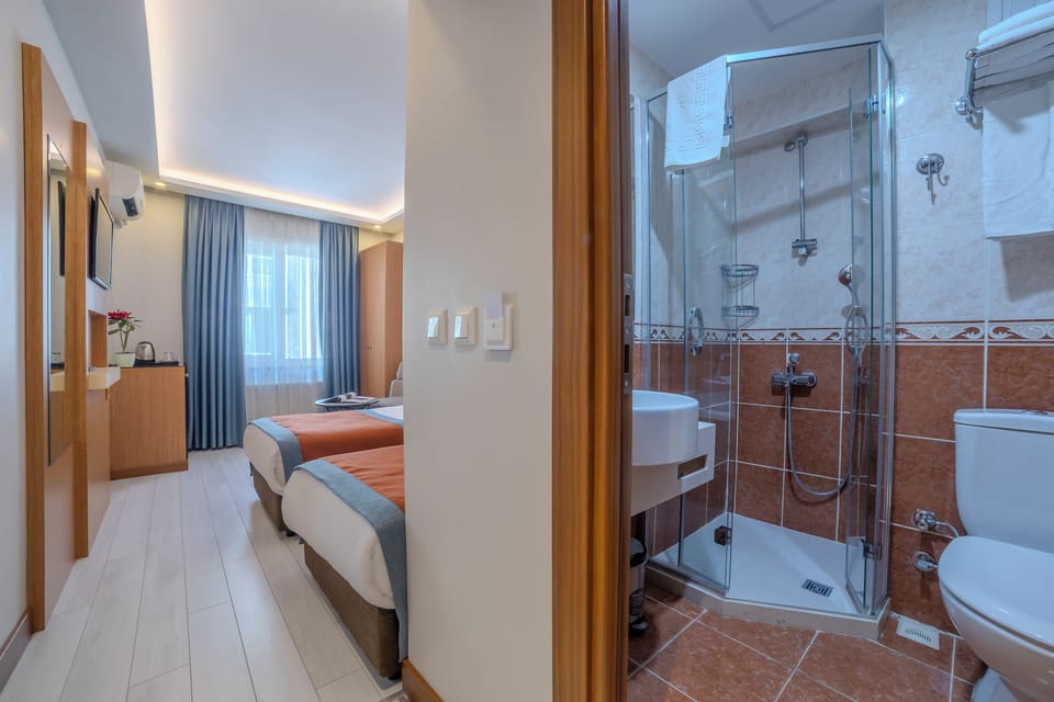 Shower, hair dryer, slippers, towels