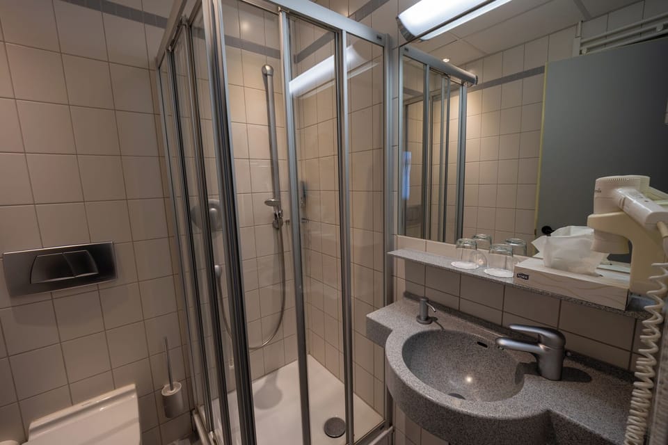 Double Room | Bathroom | Shower, hair dryer, towels, soap
