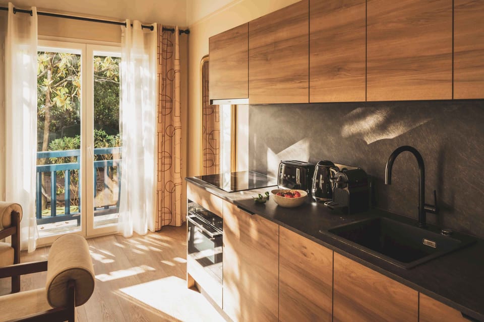 A sleek, contemporary kitchen designed for easy living—ideal for preparing local produce from the Saint-Jean market.