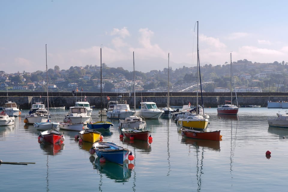 Saint-Jean-de-Luz's famous sheltered bay beach, one of the finest on the Basque coast, basks under a brilliant summer sky.