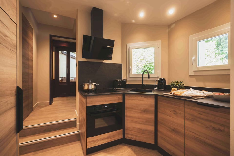 A stylish open kitchen designed for easy living, ideal for sharing meals made with fresh local ingredients.