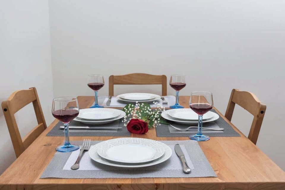 Bright dining space with a beautifully set table, ideal for enjoying meals together.