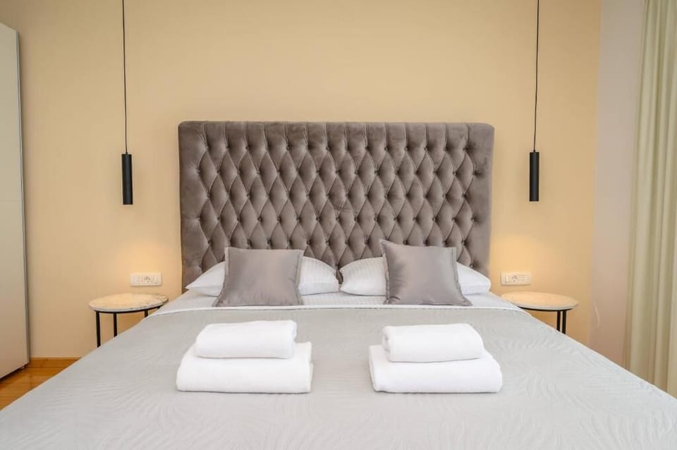 Deluxe Double Room, Balcony | In-room safe, desk, laptop workspace, blackout drapes