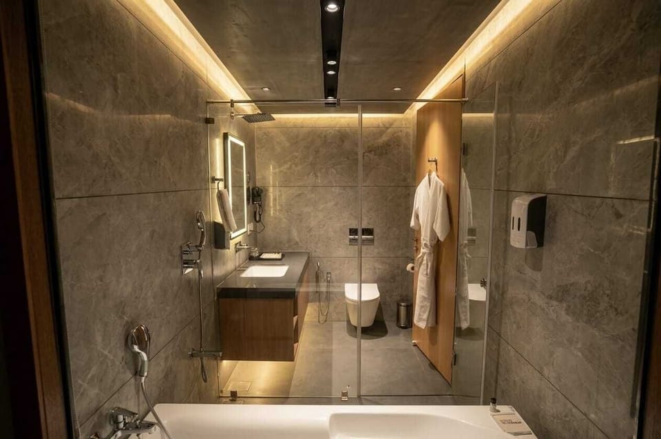 Separate tub and shower, free toiletries, hair dryer, slippers