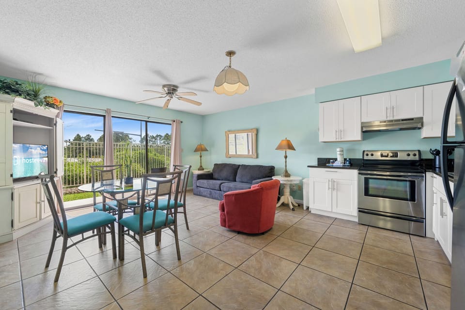Signature Condo, 1 Bedroom, Patio, Garden View | Living room | 50-inch Smart TV with digital channels