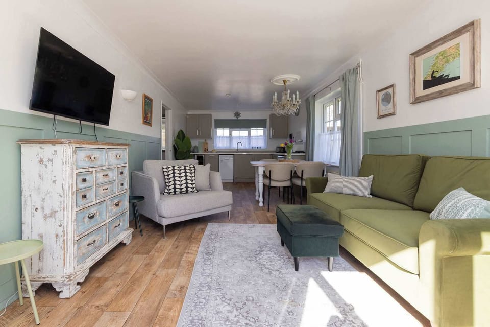 Stylish open-plan living brings together comfort, dining and extra sleeping space for couples, families or longer stays.