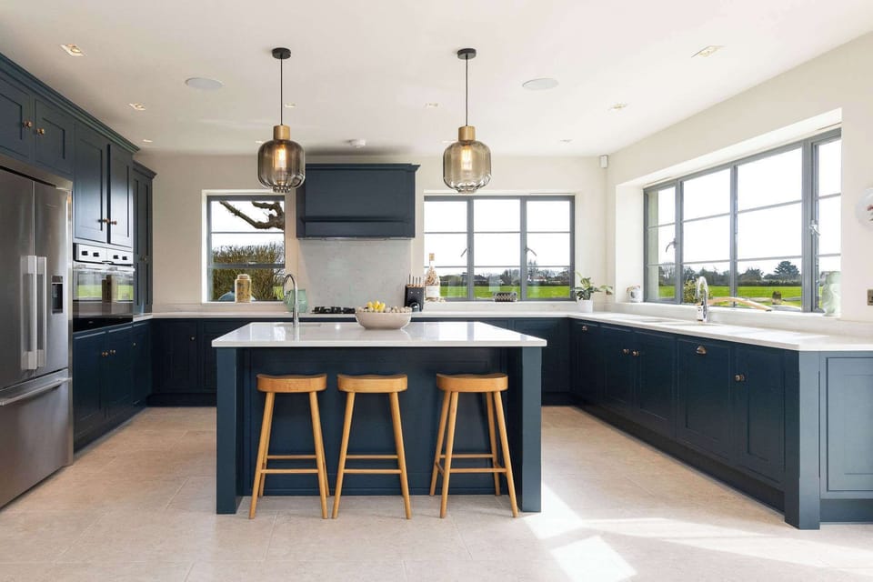 Fully equipped kitchen with stylish cabinetry, ample workspace, and natural light flooding in beautifully.