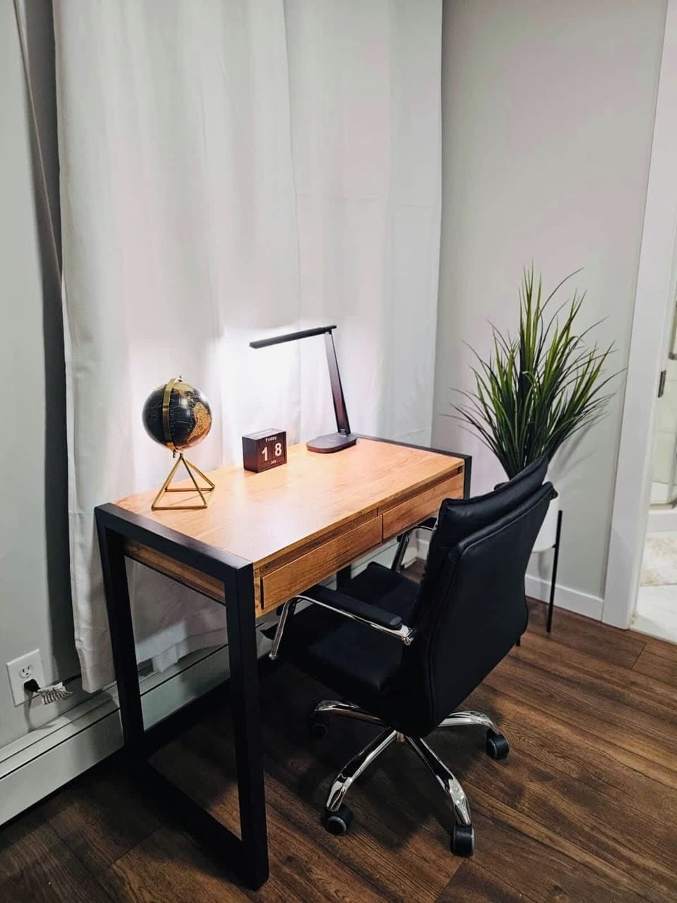 The space includes a dedicated workspace with a desk, perfect for getting work done comfortably.