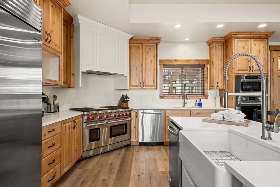 Your gourmet kitchen awaits with its sleek stainless steel appliances, professional-grade range, and gleaming countertops—perfect for whipping up anything from morning coffee to a full feast.