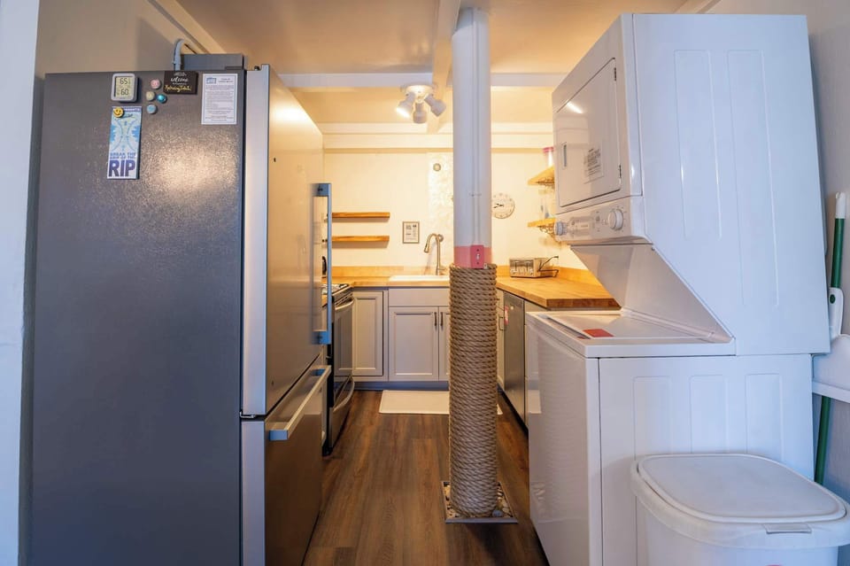 Renovated Kitchen with stacked washer and dryer