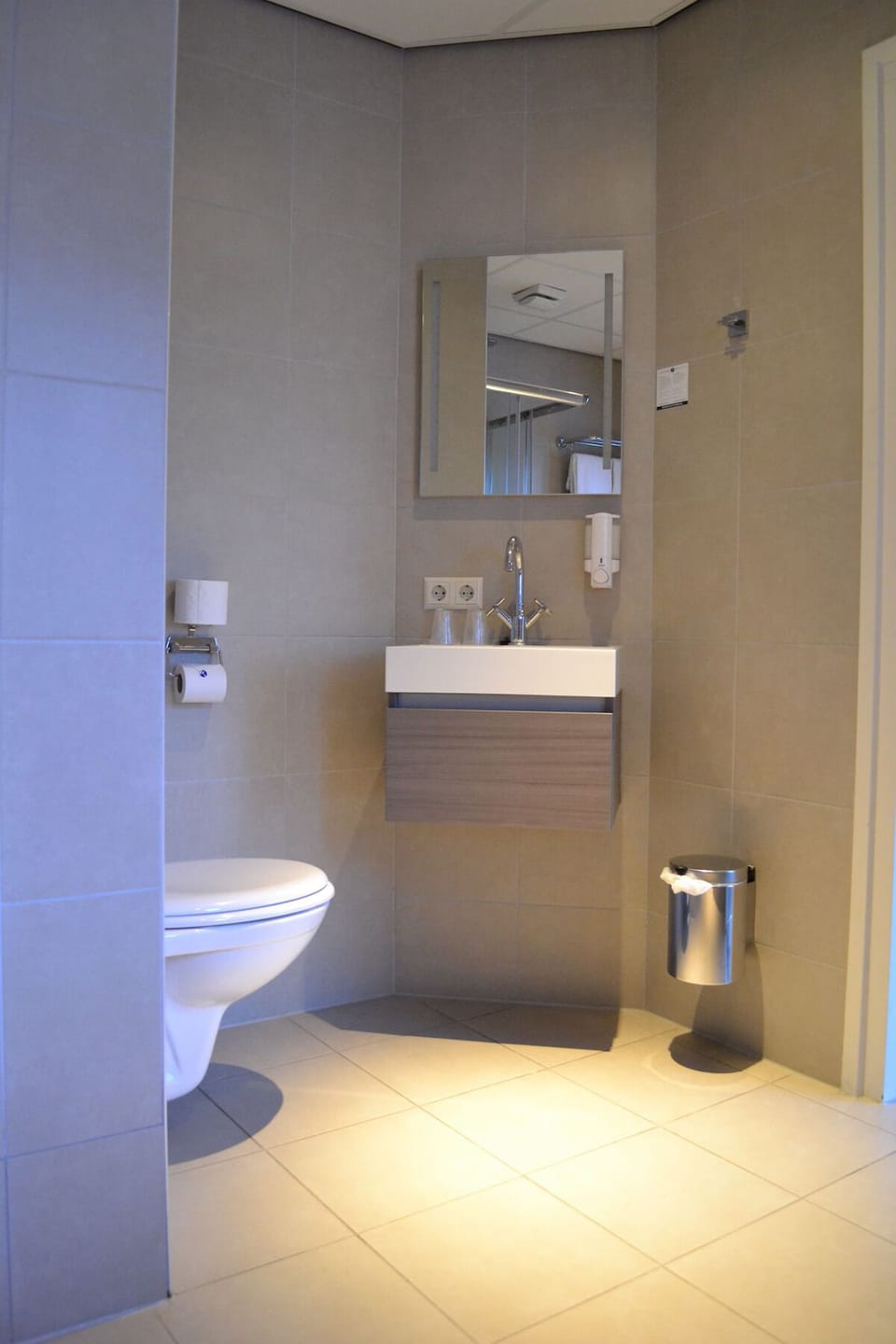 Enjoy a simple, comfortable bathroom setup with generous space.