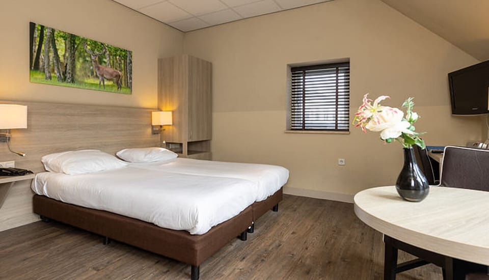 Settle into crisp linens and soft lighting for deep sleep.