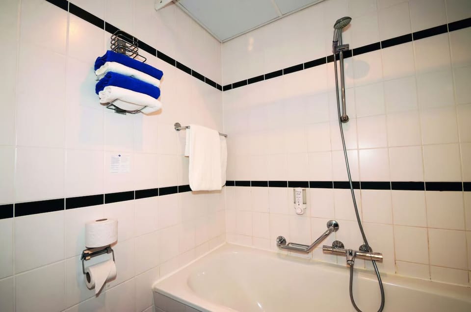 Refresh after exploring with a bright, clean shower-bath combo.
