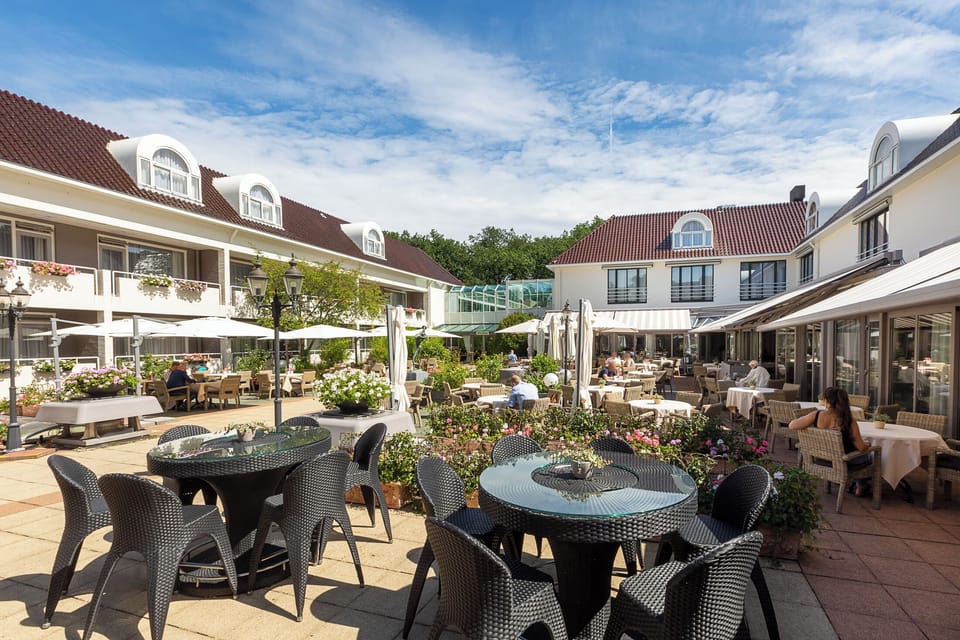 Step into the sunlit courtyard and savor relaxed terrace dining.
