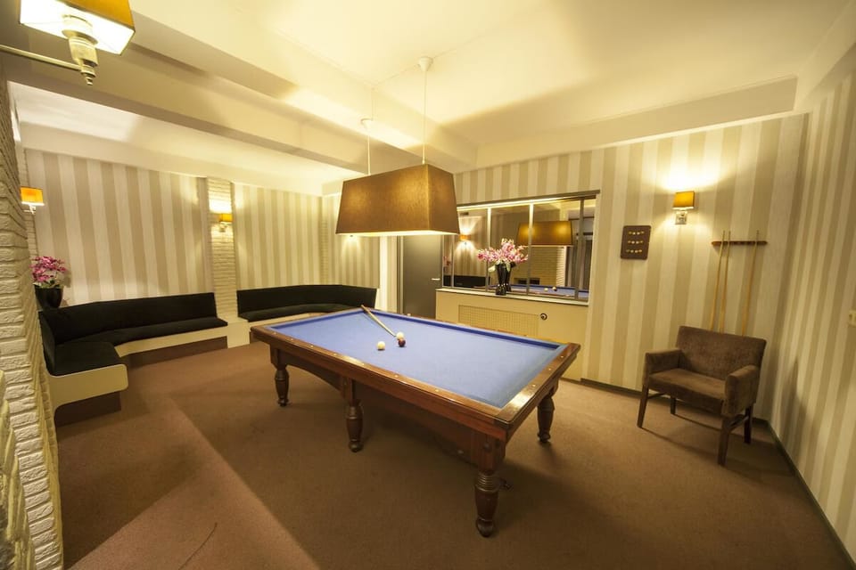 Challenge friends to an evening game of billiards in comfort.