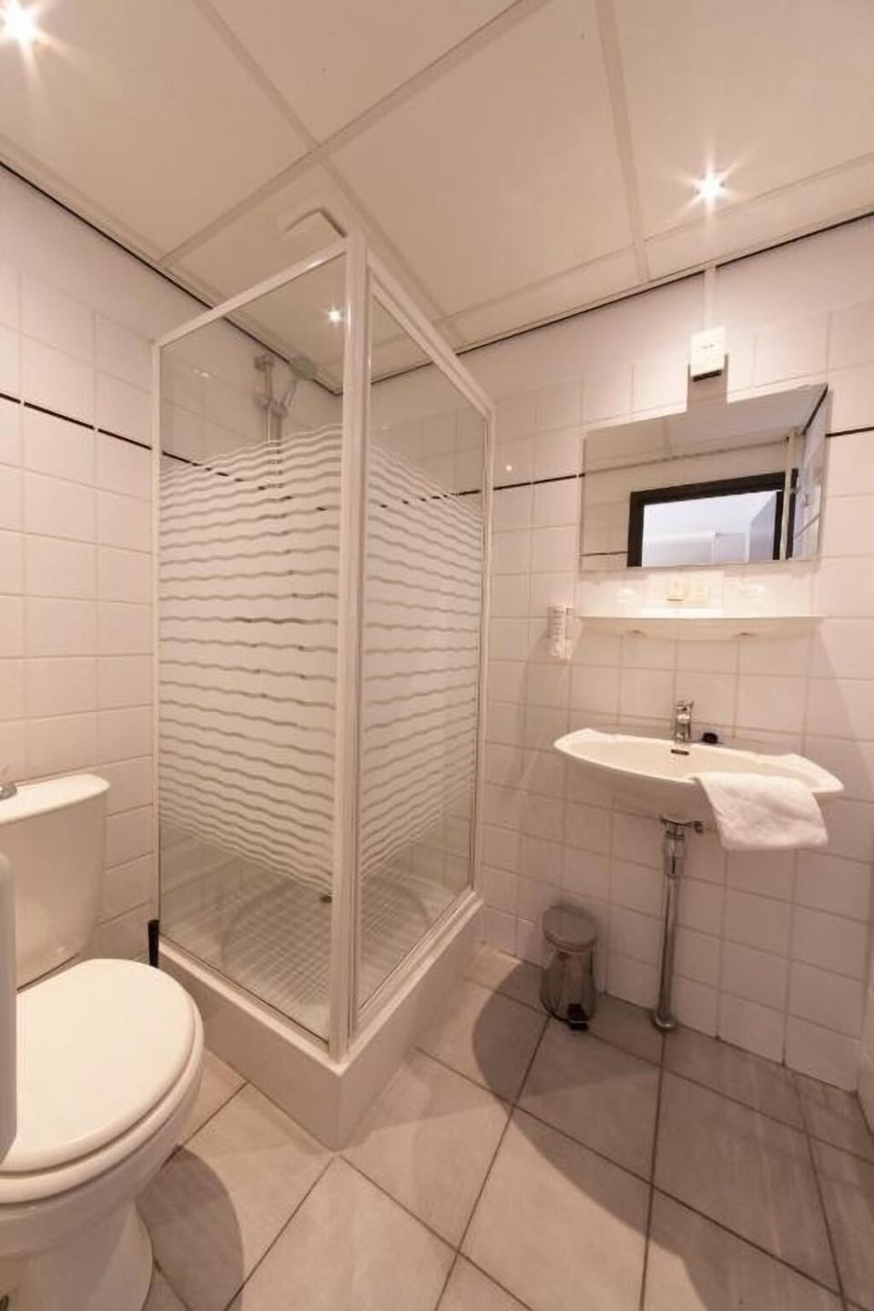 Wake up gently with a spacious shower and fresh towels.