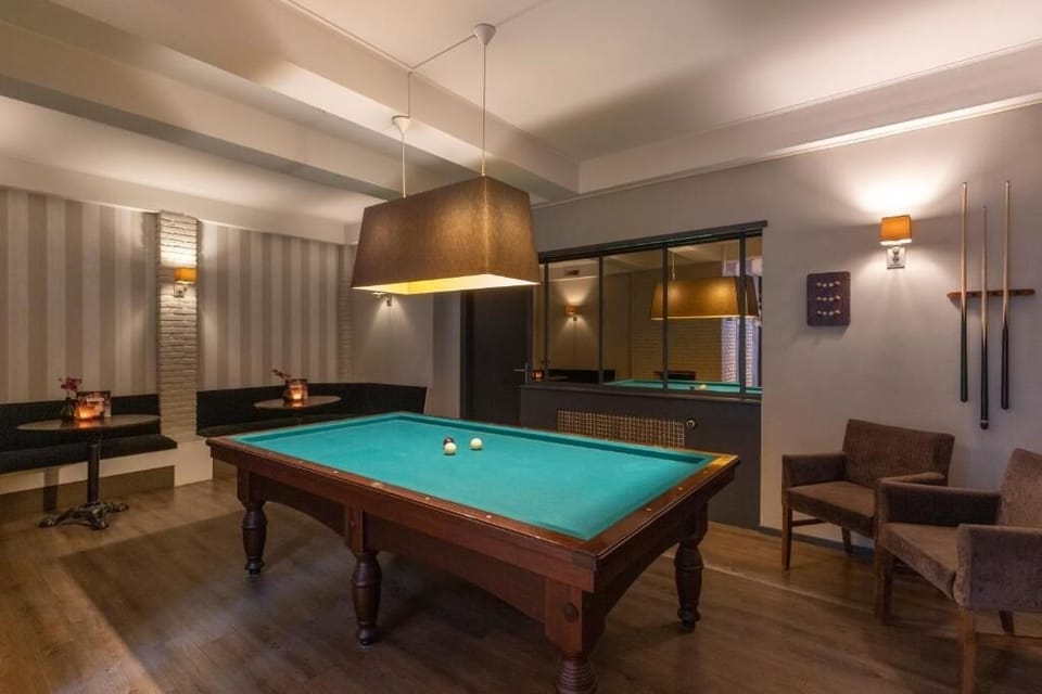Challenge friends to an evening billiards match in cozy lounge.