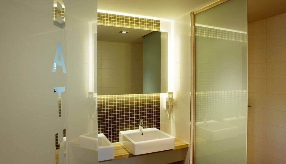 Start the day with a glowing mirror and spa-like sink area.