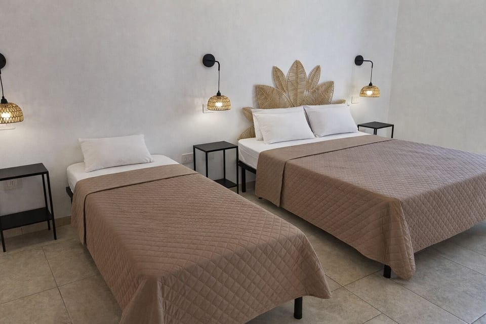 Triple Room, Private Bathroom, Garden View | Minibar, in-room safe, desk, laptop workspace