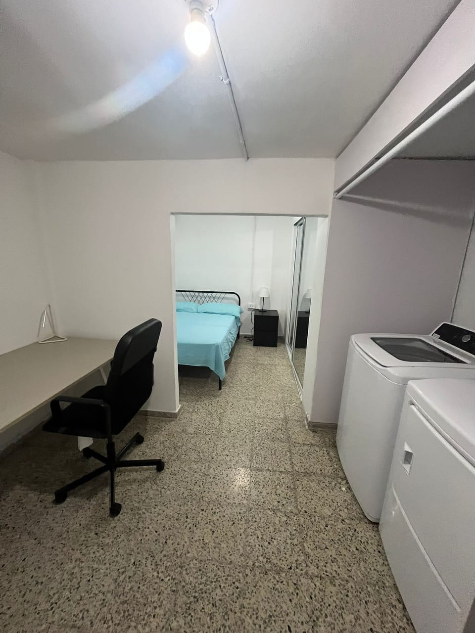 Bedroom has a office space and laundry room with private back yard entrance.
