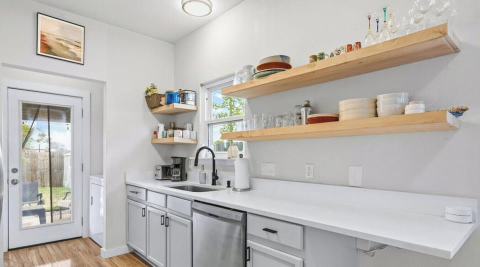 Grab a fresh cup from the coffee station and head straight out to the backyard through the kitchen door.