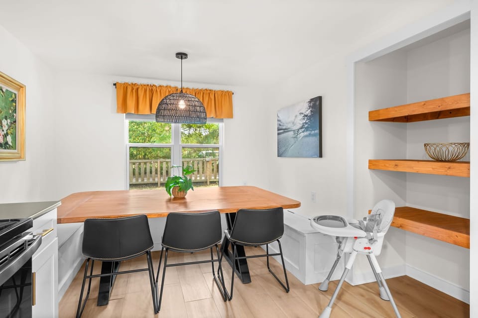 A large wrap around kitchen table can fit the whole family.