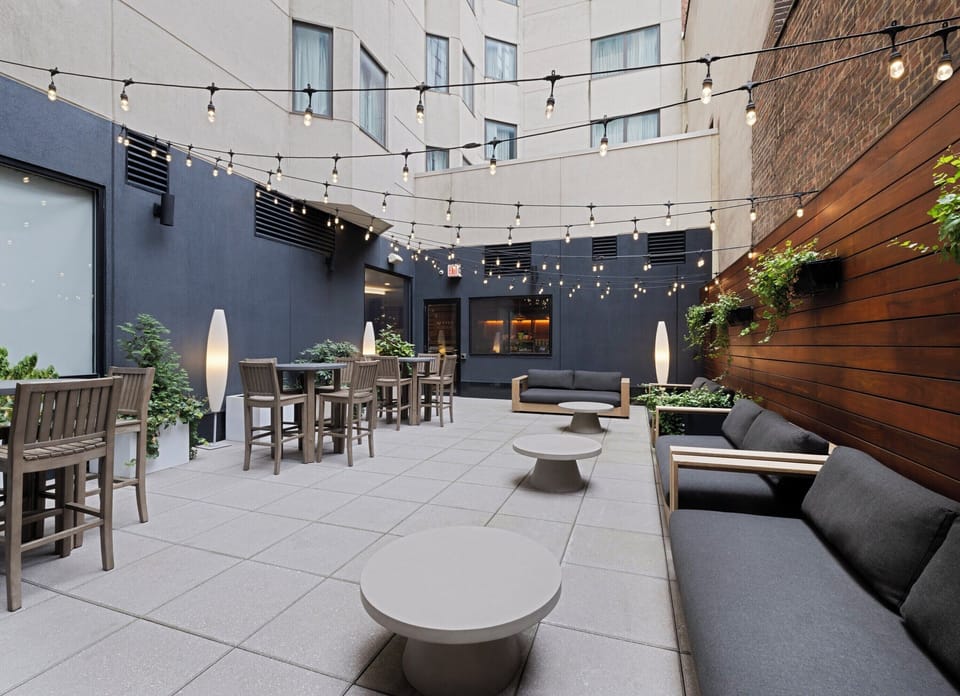 Gather with friends around lounge seating and relaxed outdoor tables.