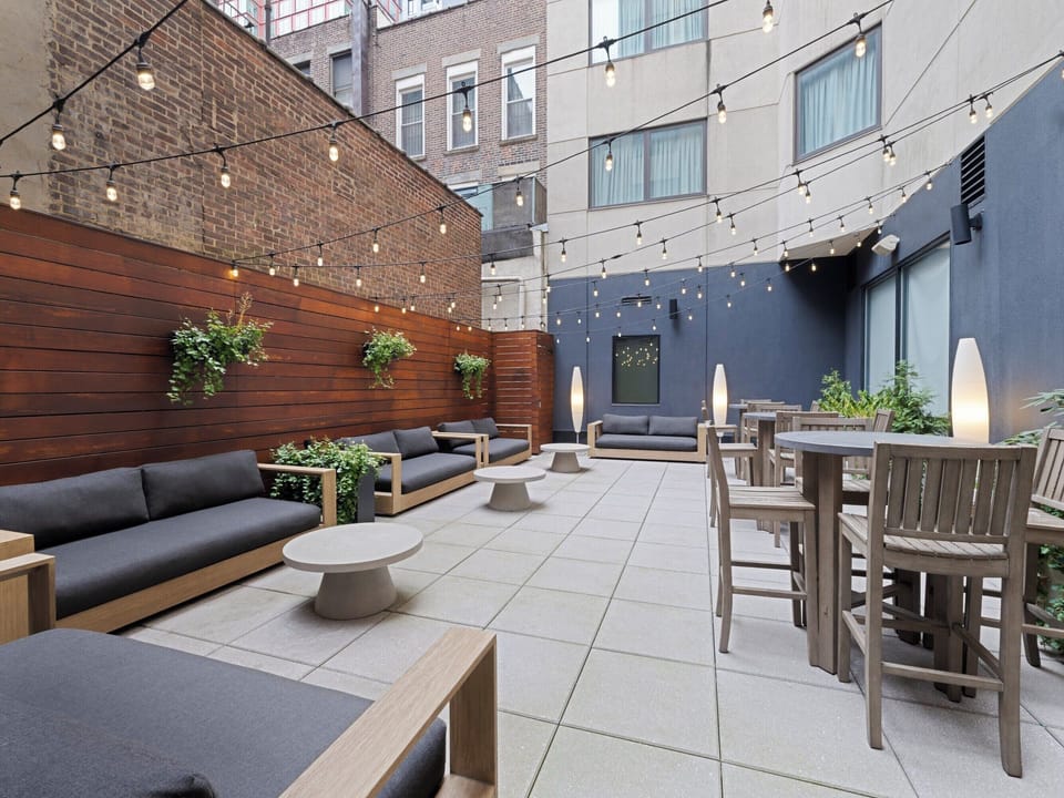 Unwind under twinkling lights in this private social courtyard.
