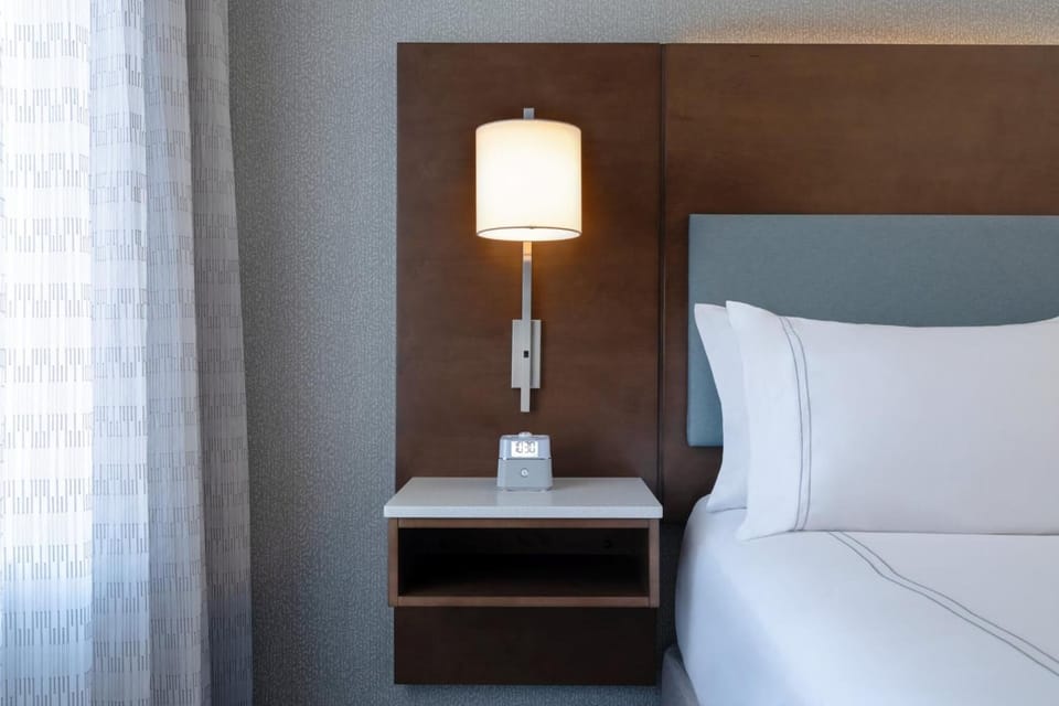 Recharge beside soft lighting and crisp, hotel-quality linens.