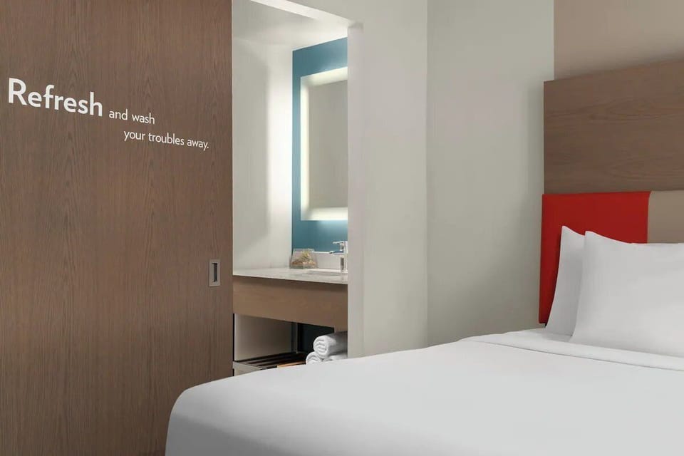Settle in with sleek design and convenient in-room vanity.