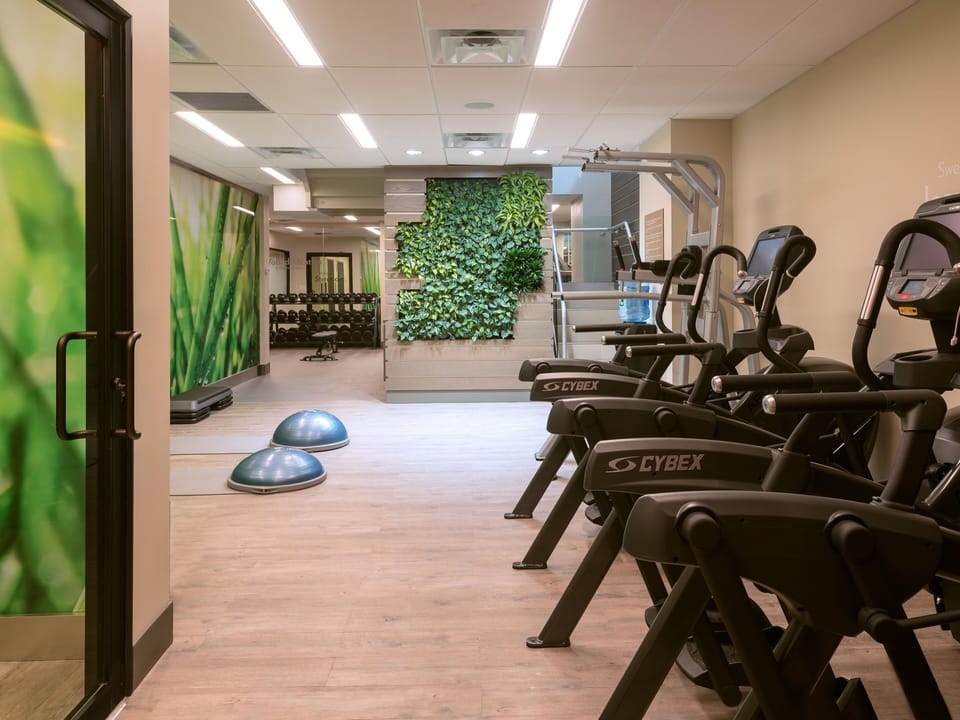 Keep your routine going with modern treadmills and open floors.