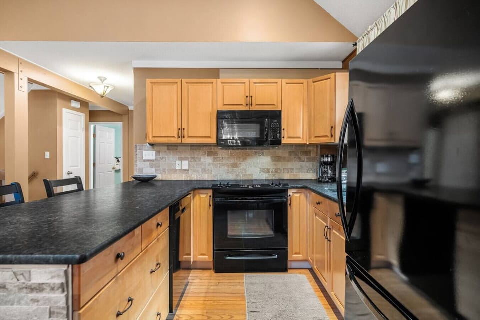 Full kitchen with a kettle, drip coffee machine, ground coffee, tea, sugar and basic condiments (ketchup, mustard and relish.)