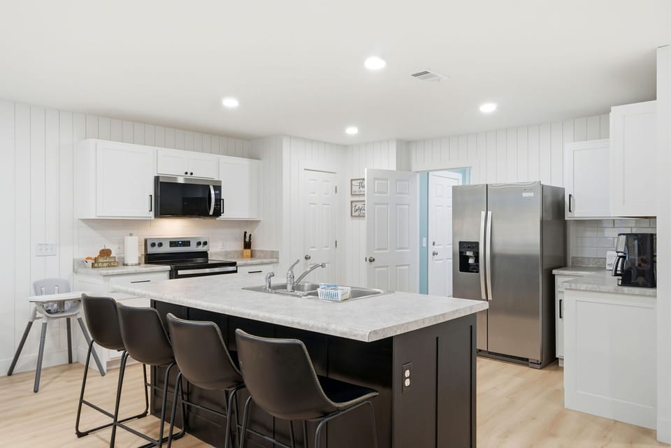 Modern White Kitchen w/ Large Island, Bar Seating & Stainless Appliances!