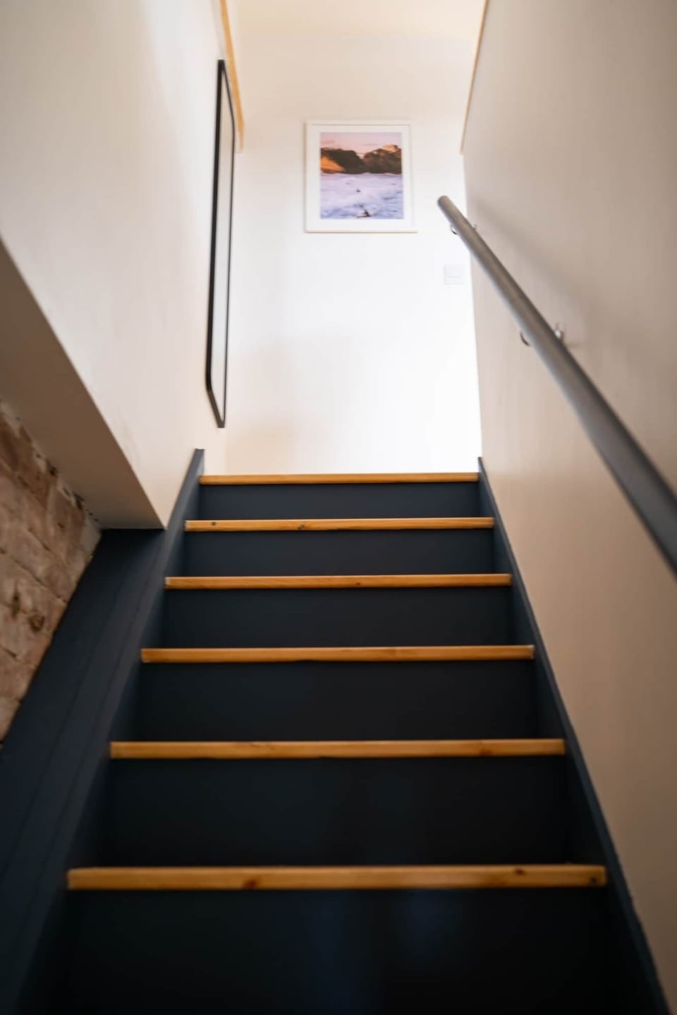 Navy bunk detail with warm timber trim