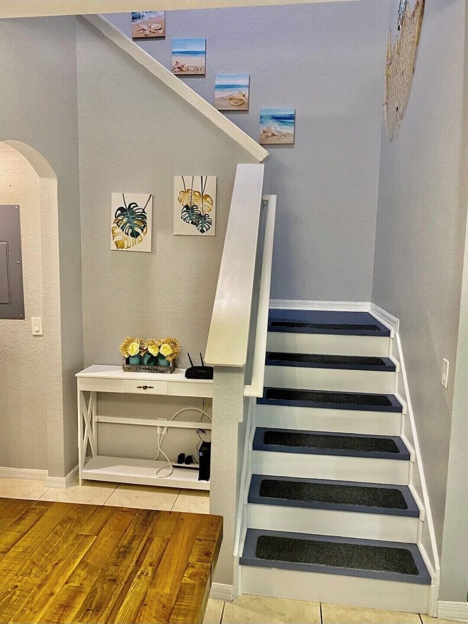 The baseboard molding and stair area have all been newly painted.