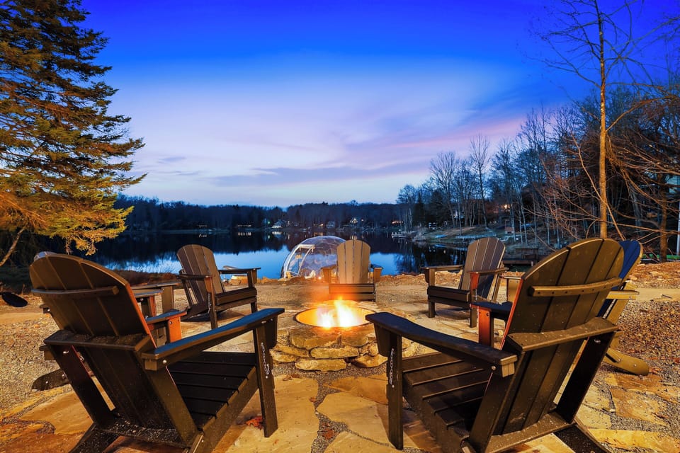 Cozy lakeside fire pit under the stars. Perfect for s'mores and stories!
