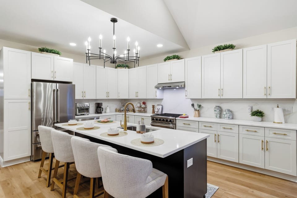 Modern chef's kitchen with a grand island. The heart of your vacation home!