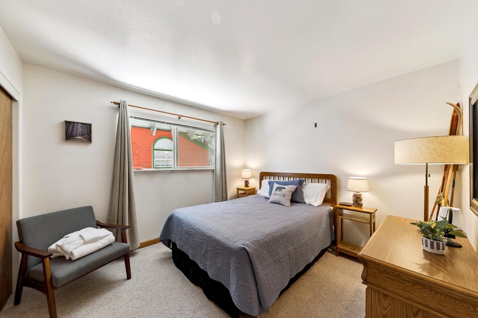 Cozy bedroom retreat with natural light and warm decor