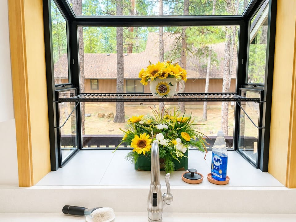 Large open kitchen is fully equipped for cooking-in with bar seating for two.