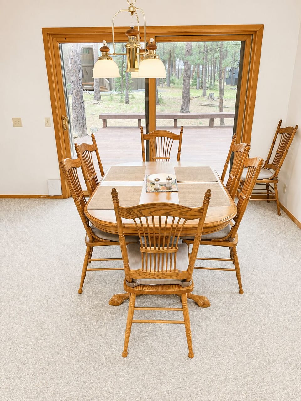 Downstairs dining room table with seating for 6-8.