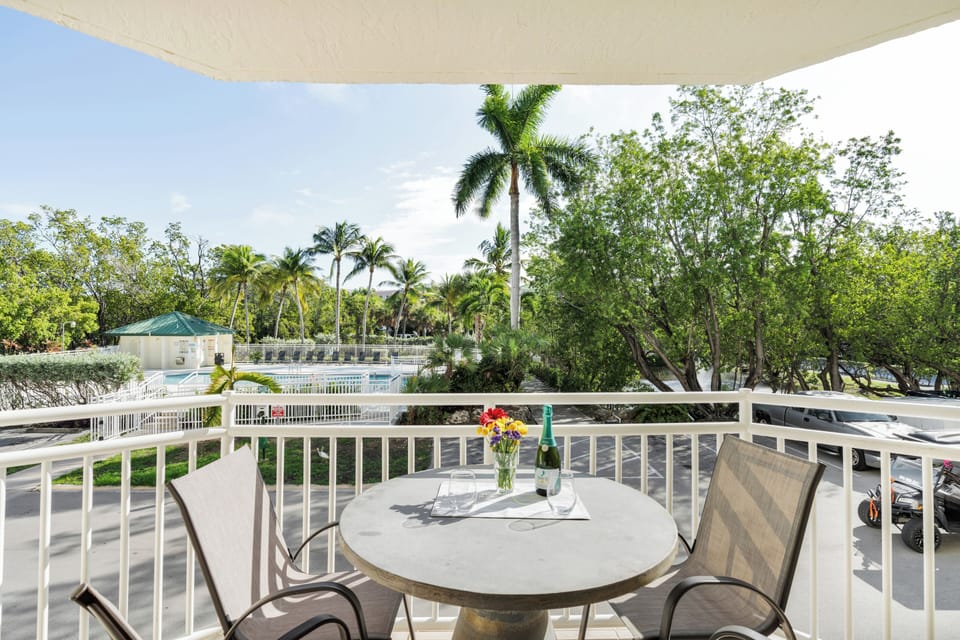 Private furnished balcony with outdoor seating, perfect for morning coffee or ev