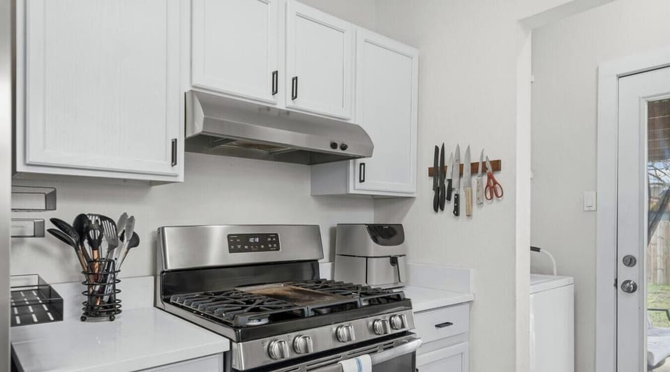 Gas range and ample counter space make cooking for the group a breeze. Step right out to the patio through the back door.