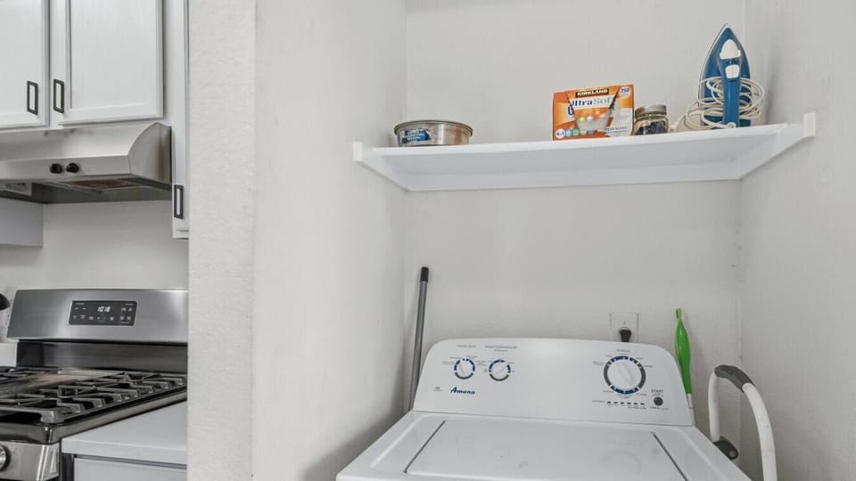 Pack light and keep your travel wardrobe fresh with the in-unit washer. Supplies shelf right above for easy access.